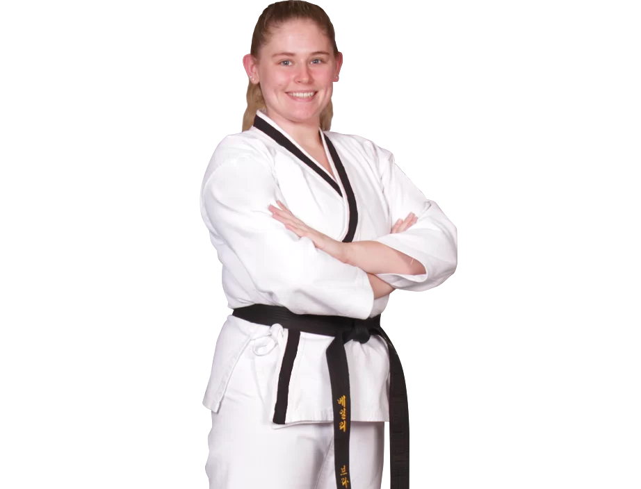 woman in a karate gi with arms crossed